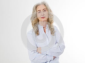 Happy senior woman with crossed arms  on white background. Positive elderly seniors life living and european old beauty