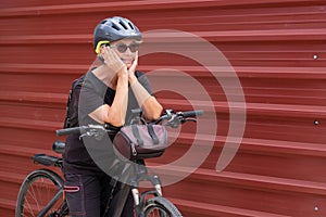 Happy senior woman cyclist in outdoor excursion in urban city. Elderly people ejoying healthy lifestyle