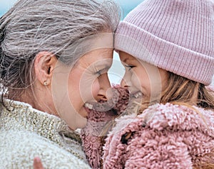 Happy senior woman, family and girl spending quality time together in the park during autumn. Cute little child and her