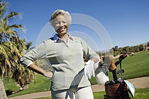 Happy Senior Woman With Golf Bag