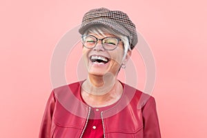 Happy senior woman having fun outdoor - Trendy mature person laughing and enjoying retired time