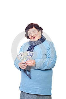 Happy senior woman holding Romanian cash