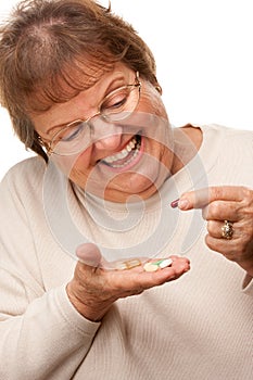 Happy Senior Woman and Medication Pills