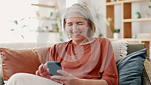 Happy senior woman, phone and relax on sofa for social media, communication or networking at home. Elderly female person