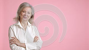Happy senior woman pointing to copy space, suggesting for advertisement or text