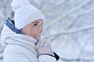 Happy senior woman posing at winter park