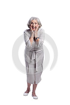 Happy senior woman wearing light dress isolated
