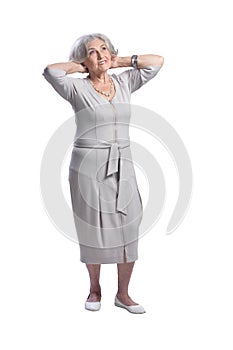 Happy senior woman wearing light dress isolated