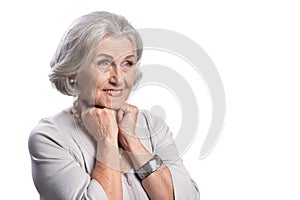 Happy senior woman wearing light dress posing on white background