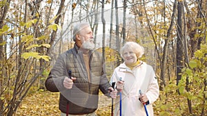 happy serious loving couple admire with beautiful forest in autumn