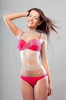 Happy sexual hot woman wearing bikini photo