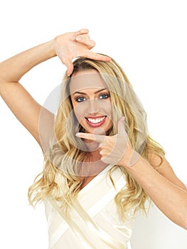 Happy Young Woman Posing By Framing Her Face With Her Hands