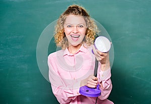 Happy shining. student girl working with electricity. teacher with lamp at school blackboard. brainstorming woman