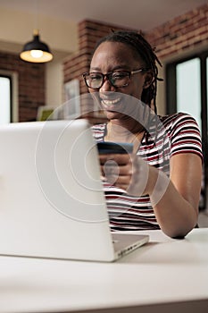 Happy shopaholic making purchase in internet store sale