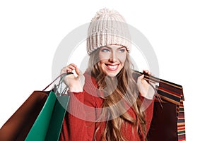 Happy shopper woman with paper bags