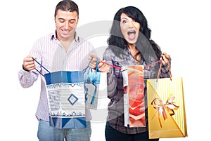 Happy shoppers couple with bags photo