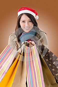Happy shopping girl holding bags