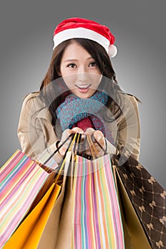 Happy shopping girl holding bags