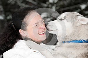 Happy siberian husky owner with dog