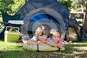 Happy siblings on a camping trip