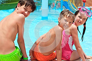 Happy siblings by pool