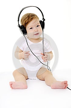 Happy singing baby with black headphones