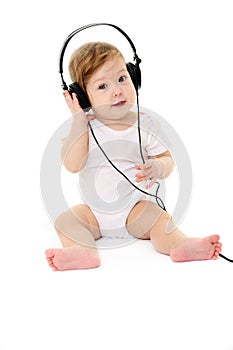 Happy singing baby wearing big black headphones