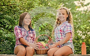 Happy sisters garden. Organic harvest. Farm market. Selling homegrown food concept. Girls cute children farming. Kids