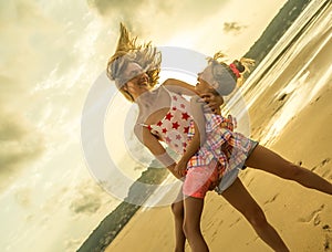 Happy sisters having beach fun