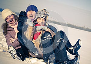 Happy sisters sledding