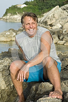 Happy sitting on a rock