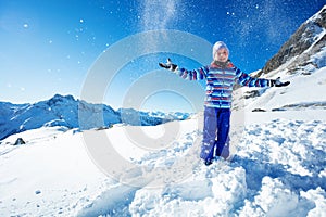 Happy ski girl portrait throw snow in the air