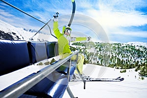 Happy skier on ski lift