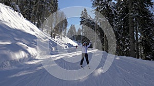 Happy Skier Skiing Down Snow Ski Slope In Snow Mountains In Winter Sunny