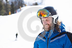 Happy skier on slope at Cortina