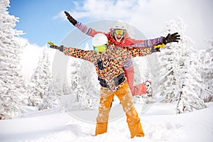 Happy skier and snowboarder having fun