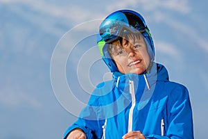 Happy skier teen portrait over mountains