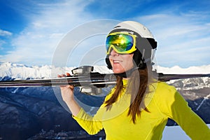 Happy skier woman on sunny day