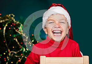 Happy small boy in santa hat