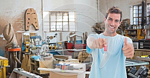 Happy small business owner man holding keys