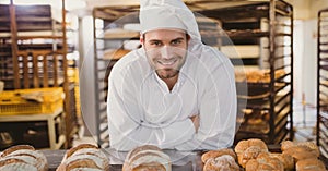 Happy small business owner man making bread