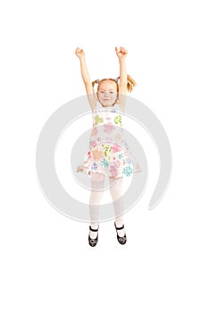 Happy small girl jumping and showing thumbs up