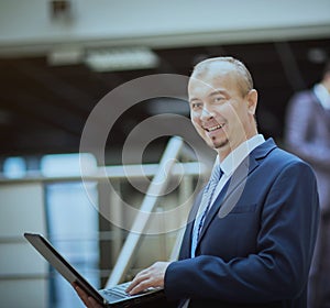 Happy smart business man with team mates discussing the background