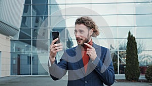 Happy smart businessman use smartphone for video call successful people.