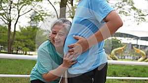 Happy and smile couples elderly asian rest after workout, jogging on morning, senior exercise outdoor for good healthy. Concept of