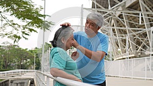 Happy and smile couples elderly asian rest after workout, jogging on morning, senior exercise outdoor for good healthy. Concept of