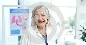 Happy, smile and face of senior doctor in her office in the hospital with confidence and positive attitude. Professional