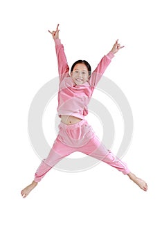 Happy and smile little Asian child girl in pink tracksuit or sport cloth jumping on air isolated over white background. Freedom