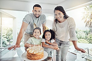 Happy, smile and portrait of a family at birthday celebration with cake, candles and fun hats at home. Happiness