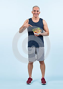 Happy smile senior man portrait holding bowl of vegan. Clout